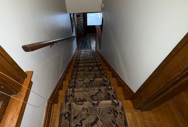 View from upstairs apartment down to front door - 40 W Tompkins St Unit 40