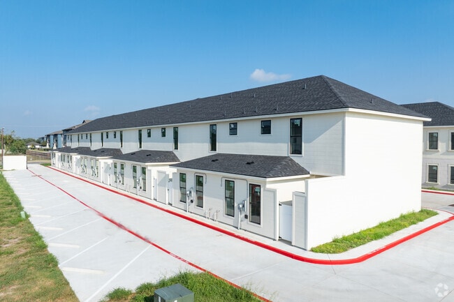 Palm Court Townhome Exterior - Palm Court Townhomes