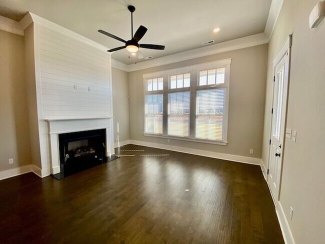 Photo - Clift Farm townhome with a fence and 3 car garage