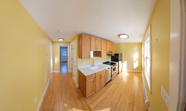 Building Photo - 571 Merrimac St Unit 571 rear