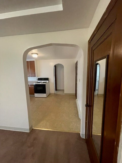 Living area looking into Kitchen - 2123 16th St Apartments Unit Studio 1