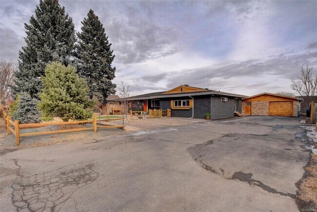 Shared driveway with included 1 car garage with access to storage.