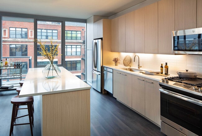 Elegant island kitchen with stainless-steel appliances