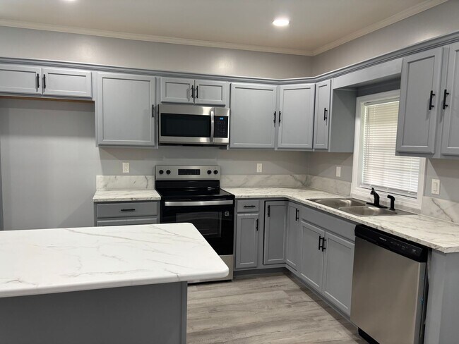 Photo - Fully renovated 3 bedroom 2 bathroom house! Lawn Care Included