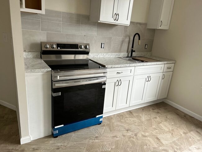 Kitchen with new stove - 1825 N 3rd St