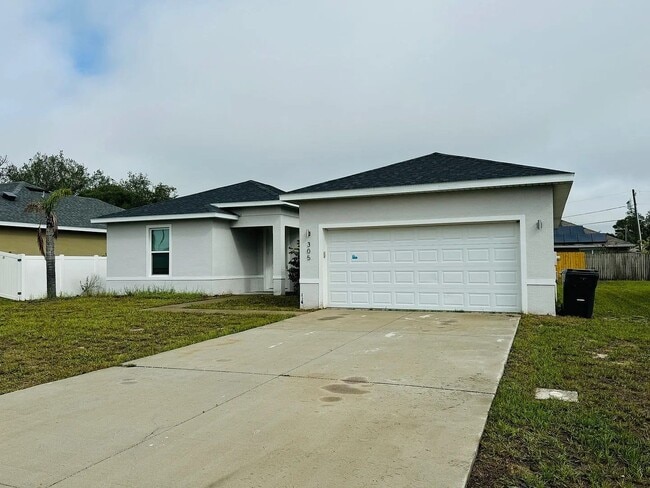 Photo - Beautiful New 3-Bedroom Home with Spacious Layout & 2-Car Garage in Poinciana Villages