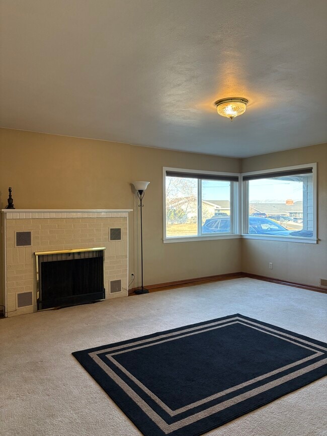 Lots of natural light in the Formal Living Room and thru out the home.