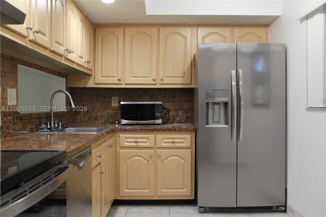 Building Photo - 8700 SW 133rd Ave Unit 301