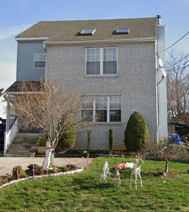 Building Photo - Discover Your Dream Home in Neptune: Spacious 4-Bedroom, 2.5-Bath with Private Backyard and Drive...