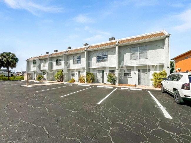 Building Photo - Petal-Perfect 2BR Cozy Cape Coral Townhouse with a Pool View! Unit 104