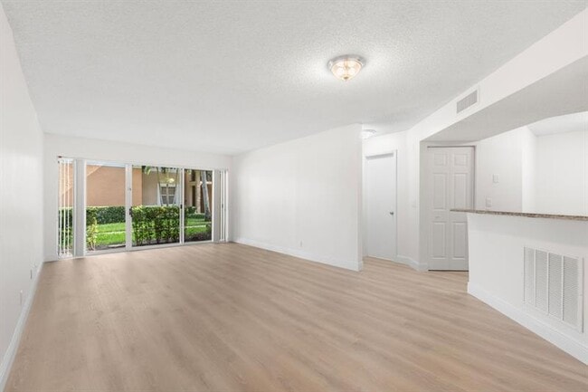 Building Photo - 8851 Wiles Rd Unit 108 Rental