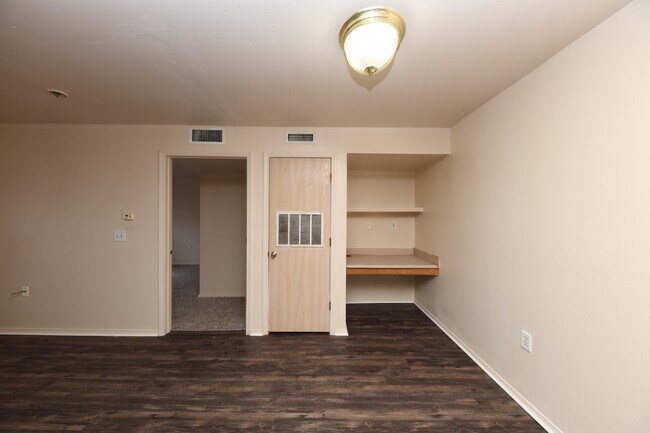Spacious living room with hardwood-style flooring