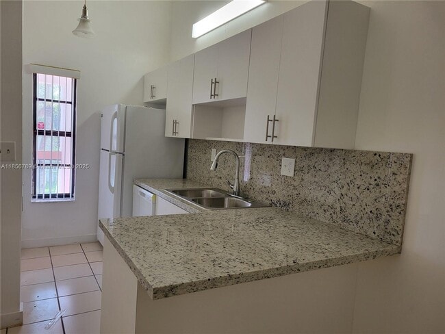 Building Photo - 7415 SW 153rd Ct Unit 203-7 Rental