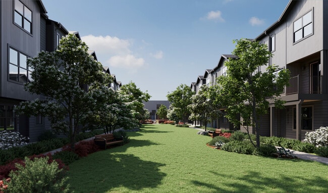 Oxenfree Clear Creek townhomes lining the amenity lawn. - Oxenfree Clear Creek