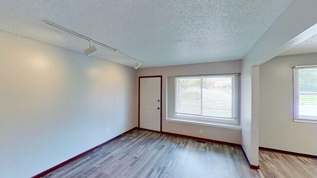 Photo - Clean three bedroom one bath duplex with walk out basement with yard looking at trees, across fro...