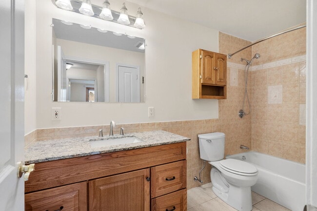Bathroom with Spacious Storage - Windjammer Apartments