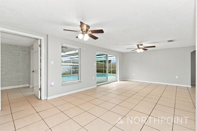Photo - 3-Bedroom, 2 Bath Single Home for Rent in Port Richey, FL | Attached Garage & Private Pool!
