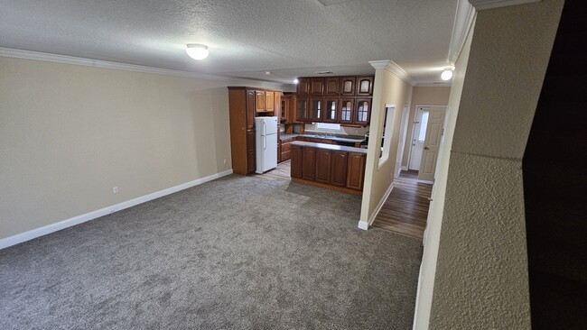 Living Room into Kitchen - 126 Meadows Ln Casa Adosada