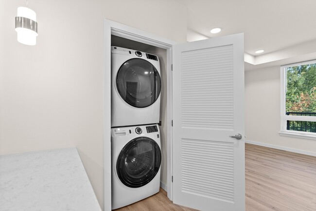 Full Size Stack Washer and Dryer In Each Home
