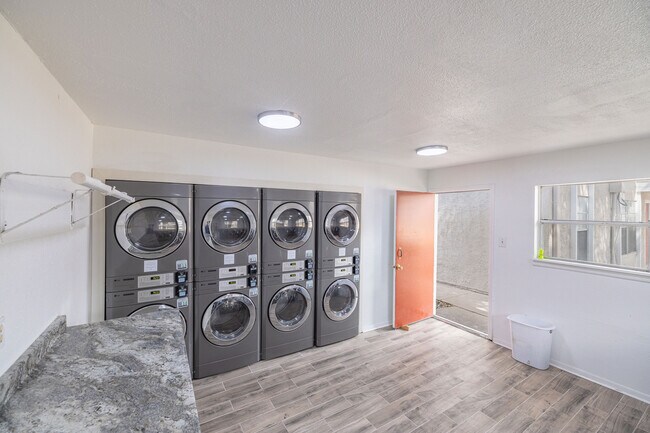 Laundry Room with Folding Table - Kingsman Apartments