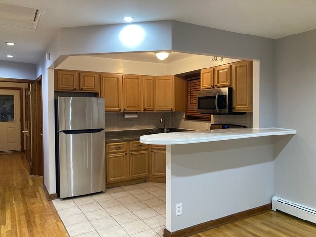 Building Photo - 6063 60th Ln Unit 3