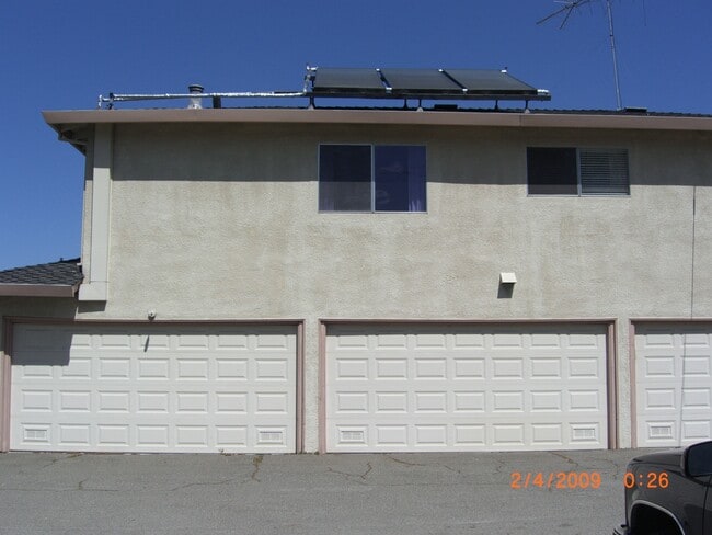 back of building with garage entry - 3140 Neal Ave Unit 4