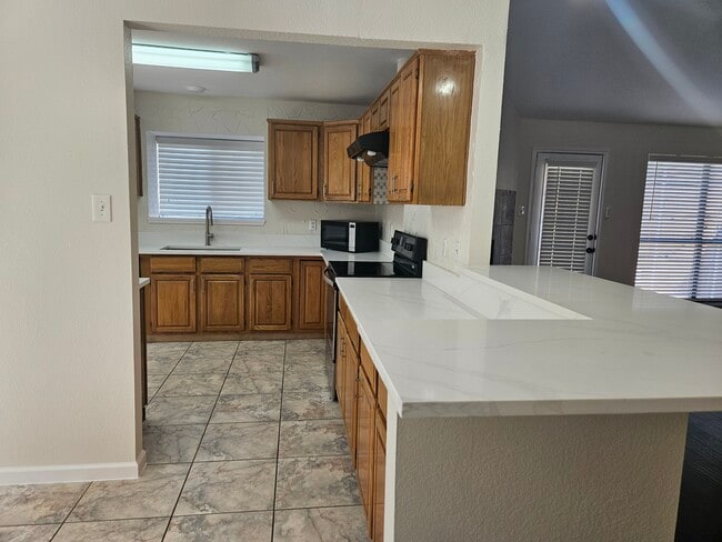 Kitchen with new quart countertop - 580 Parkway Blvd