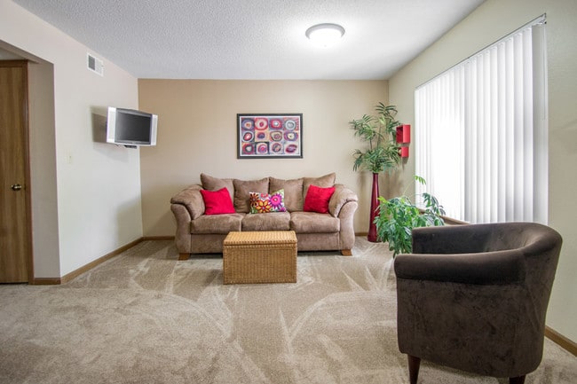 Naturally-lit Plush Living Room in Prairie West Apartments