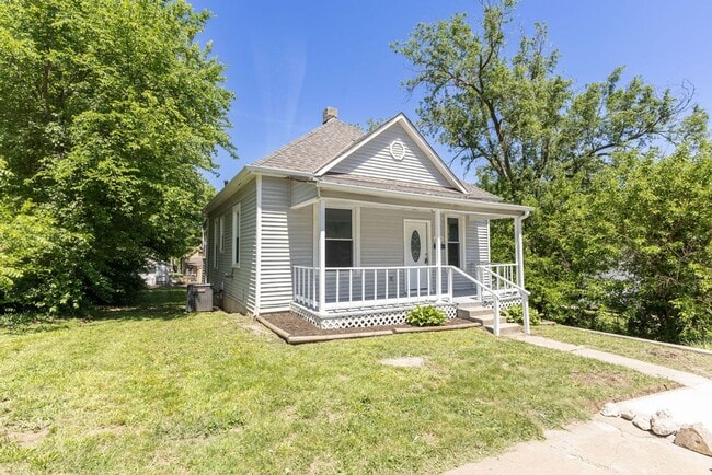 Photo - Remodeled 2-Bedroom Bungalow with Spacious Yard & 1-Car Basement Garage