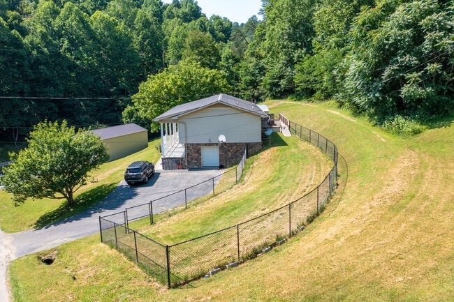 Photo - 3 br/ 2 bath home, private setting with garage/workshop