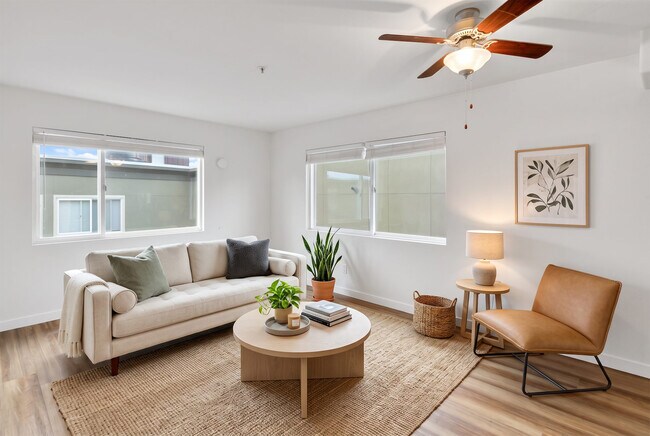 Windows on two walls give the living room even light without a single dark corner.