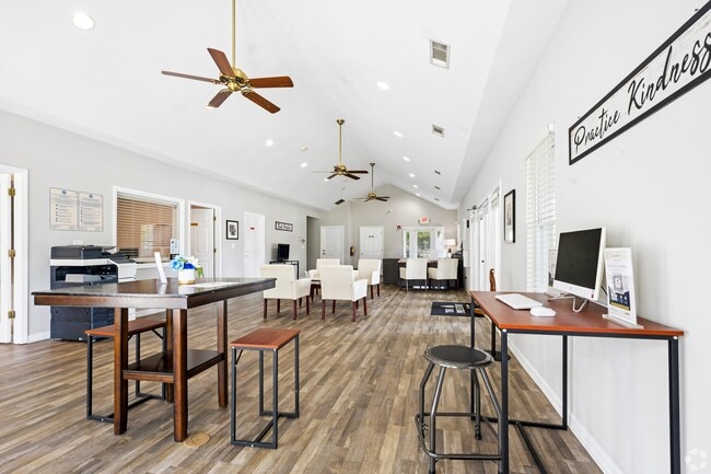 Unwind in the stylish community lounge at The Preserve On Conley Apartments. Featuring modern decor, ample seating, and a cozy atmosphere, it's perfect for relaxation or work. Schedule your visit today to see it in person!