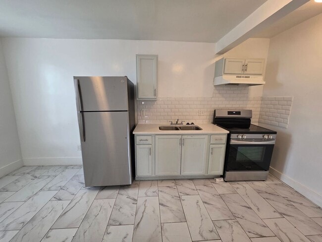 Photo - Modern 2-Bedroom Upper-Level Gem