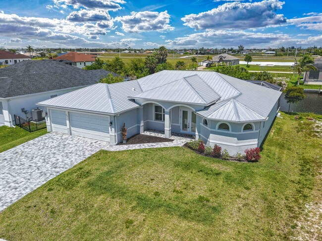 Photo - NOW AVAILABLE - Gorgeous Pool Home ~ NW Cape ~ 3 Car Garage ~ On Canal!