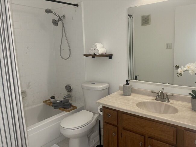 Building Photo - 6500 Sands Point Dr Unit 201