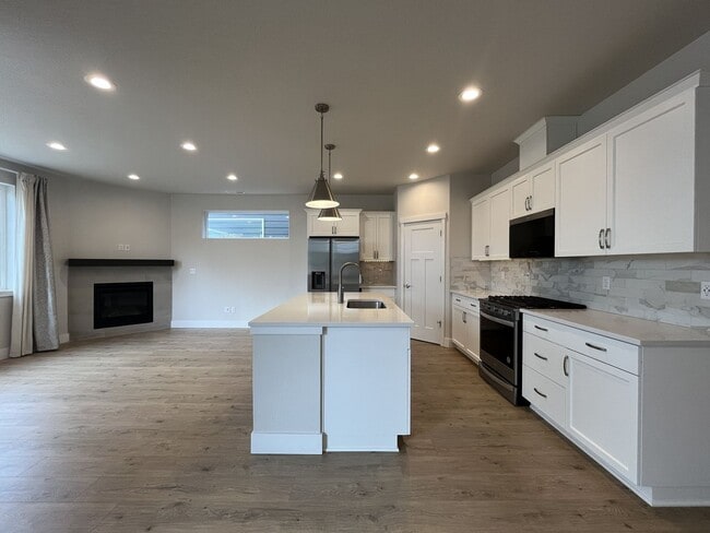 Photo - Stunning 2024 Built 5BR Home with Main-Level Suite, EV Charger & Covered Patio Near River Terrace