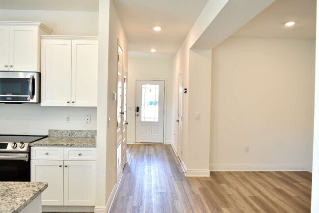 This gorgeous new construction home in Ward Creek overlooks a protected nature preserve.