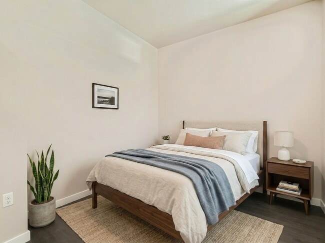 This Queen Anne bedroom easily accommodates a full or queen bed setup with matching nightstands and neutral finishes.