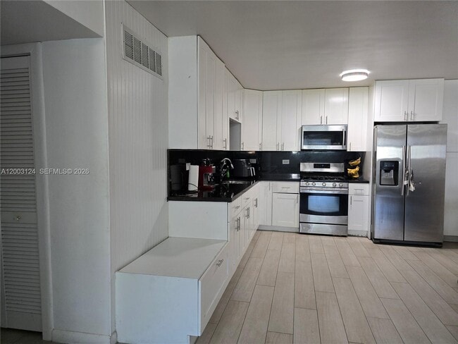Building Photo - 465 S Royal Poinciana Blvd Unit 10B