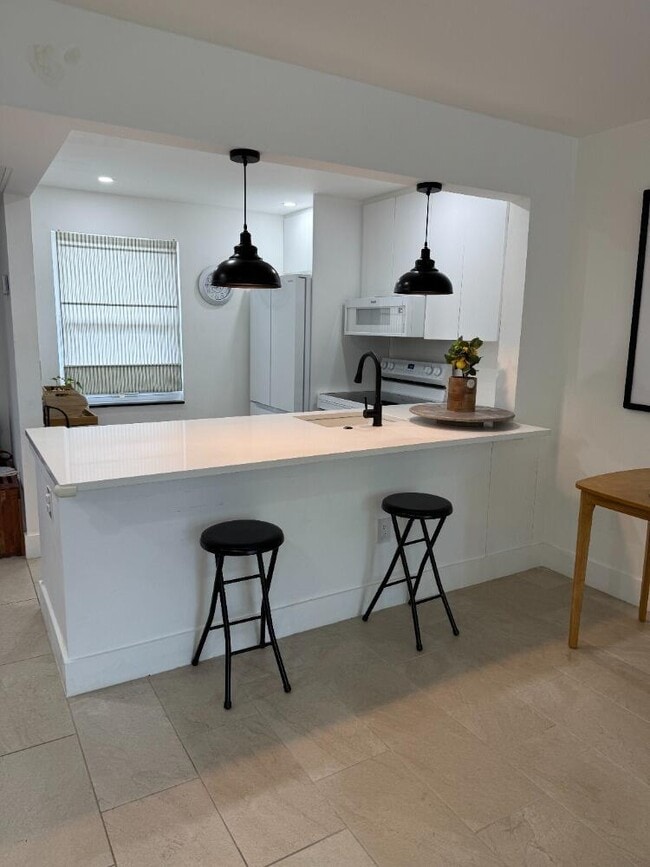 Building Photo - 9360 Lime Bay Blvd Unit 314