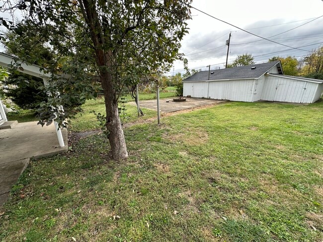 Shared back yard space with storage unit - 1508 Forest Ave Apartments Unit A