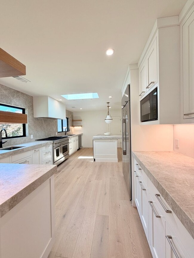 Photo - This premier 4-bed, 3-bath estate spans 2,565 sq. ft. on a 10,253 sq. ft. lot in North Los Altos.