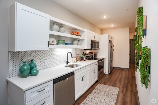 2BR, 2BA - 1,065SF -Model Kitchen - Apex Newbury