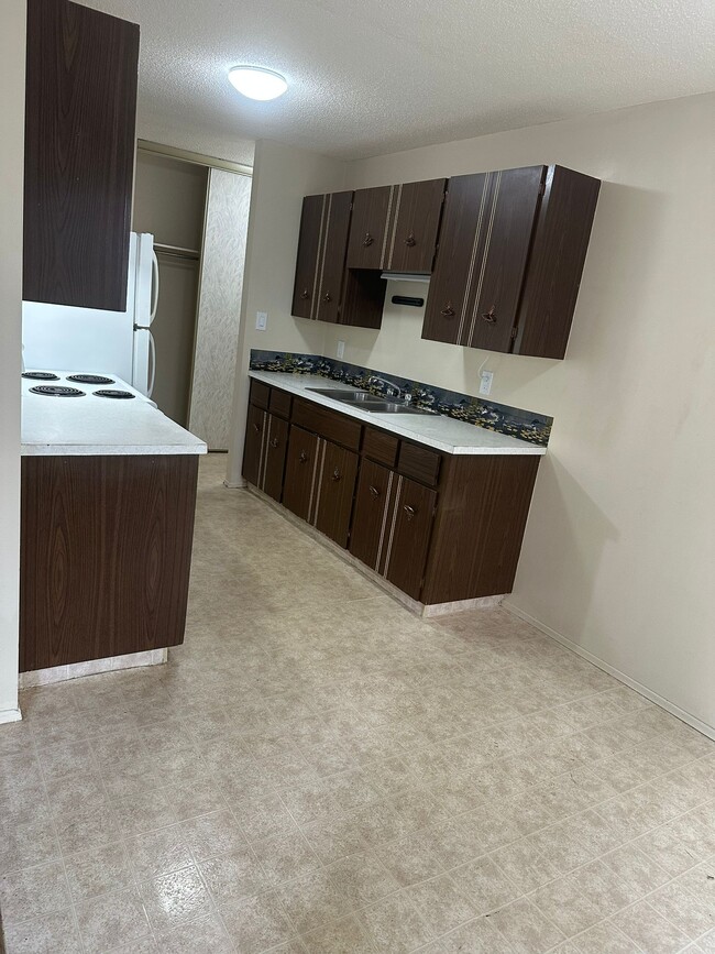 Building Photo - 4507-244 44 Ave Unit 209