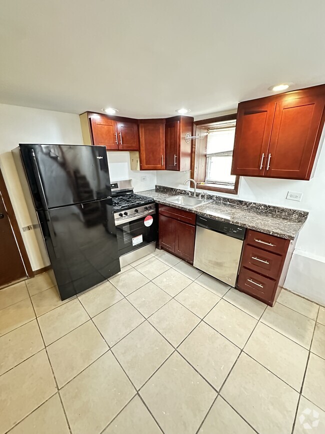 Building Photo - 2908 N Spaulding Ave Unit Coach House