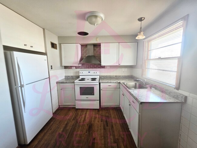 Photo - Move-In Ready 2 Bed Home with Sunroom, Garage & Fenced Yard