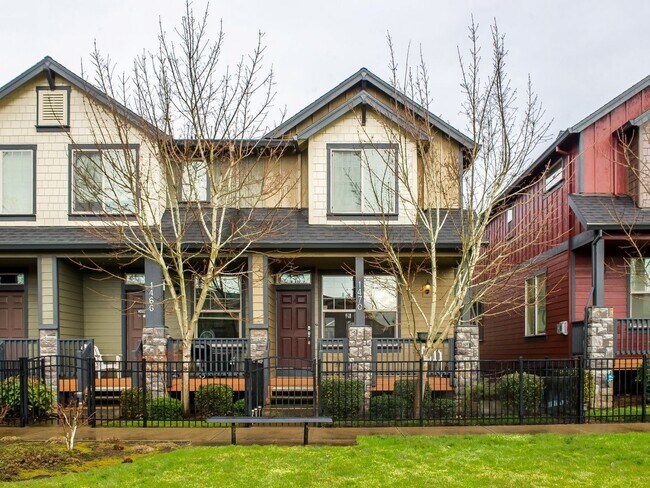 Building Photo - Fabulous 2 Bedroom 2.5 Bathroom Townhome with Vaulted Ceilings, Private Yard & Spacious Tandem Ga...