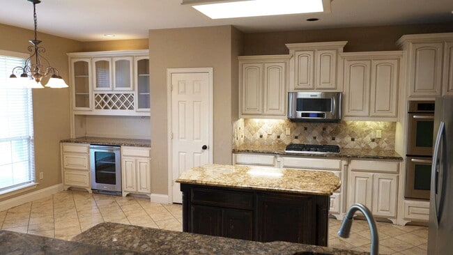 Photo - "Beautiful 4-Bedroom Home with Elegant Fin...