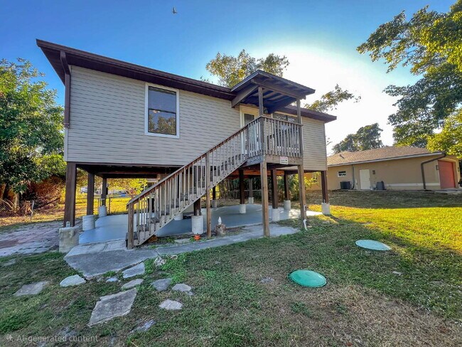 Photo - Cozy Inside, Spacious Outside: Fort Myers 2 Bed / 1 Bath + Giant Lawn + W/D Hookups — Pets Accepted