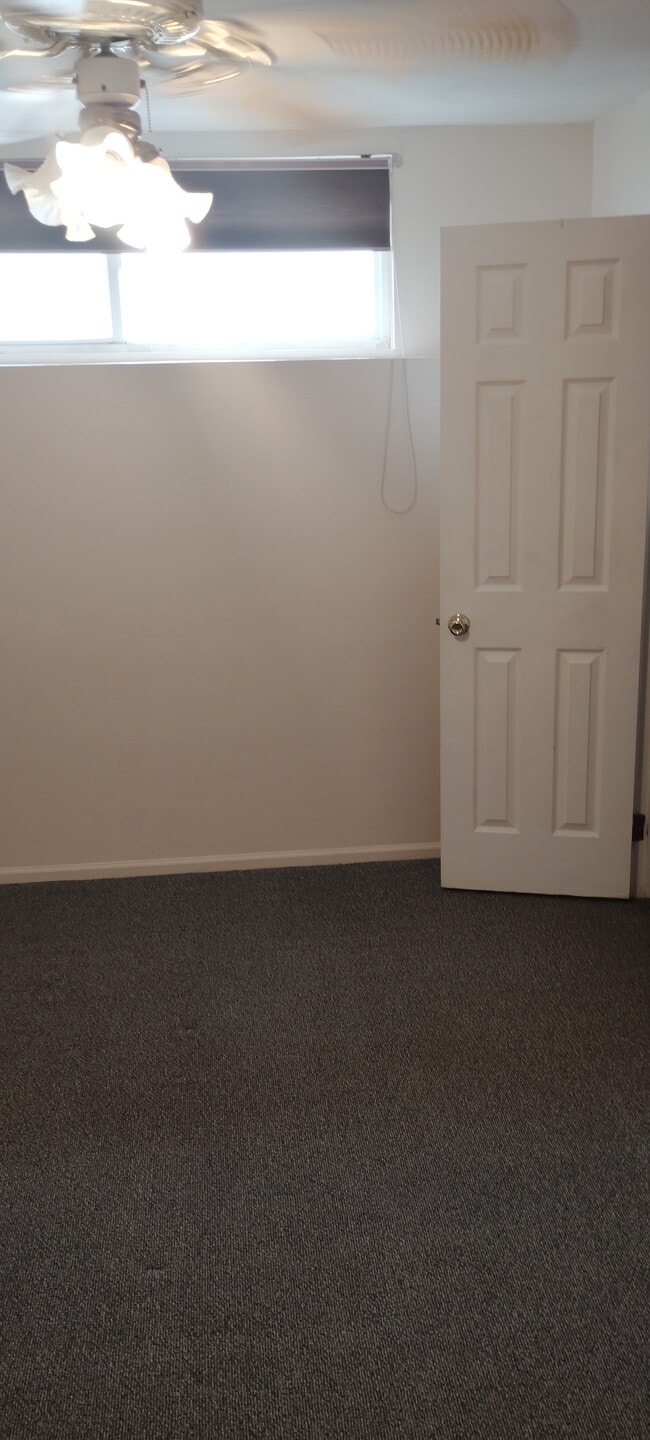 bedroom with small walk-in closet